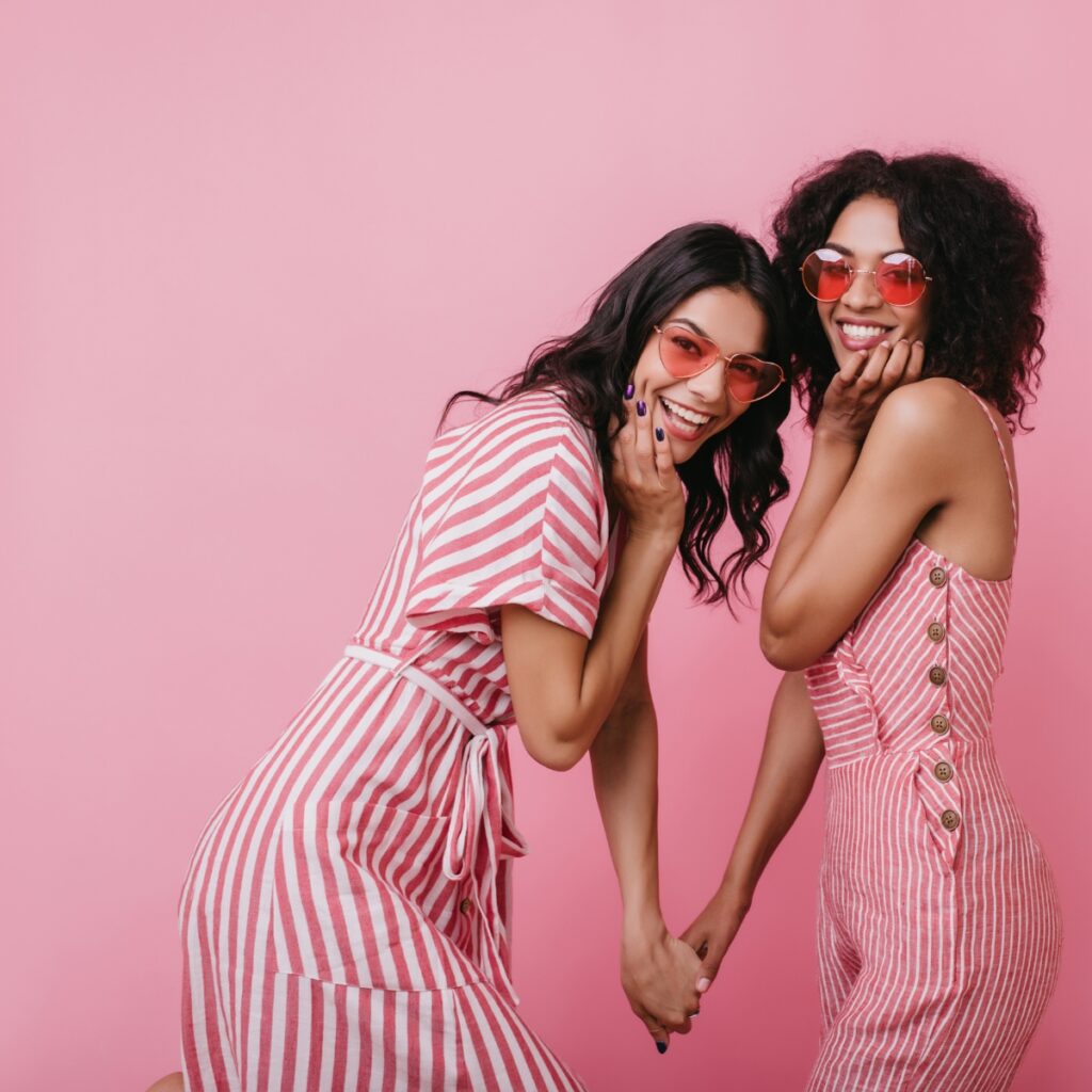 Two friends dressed in pink.