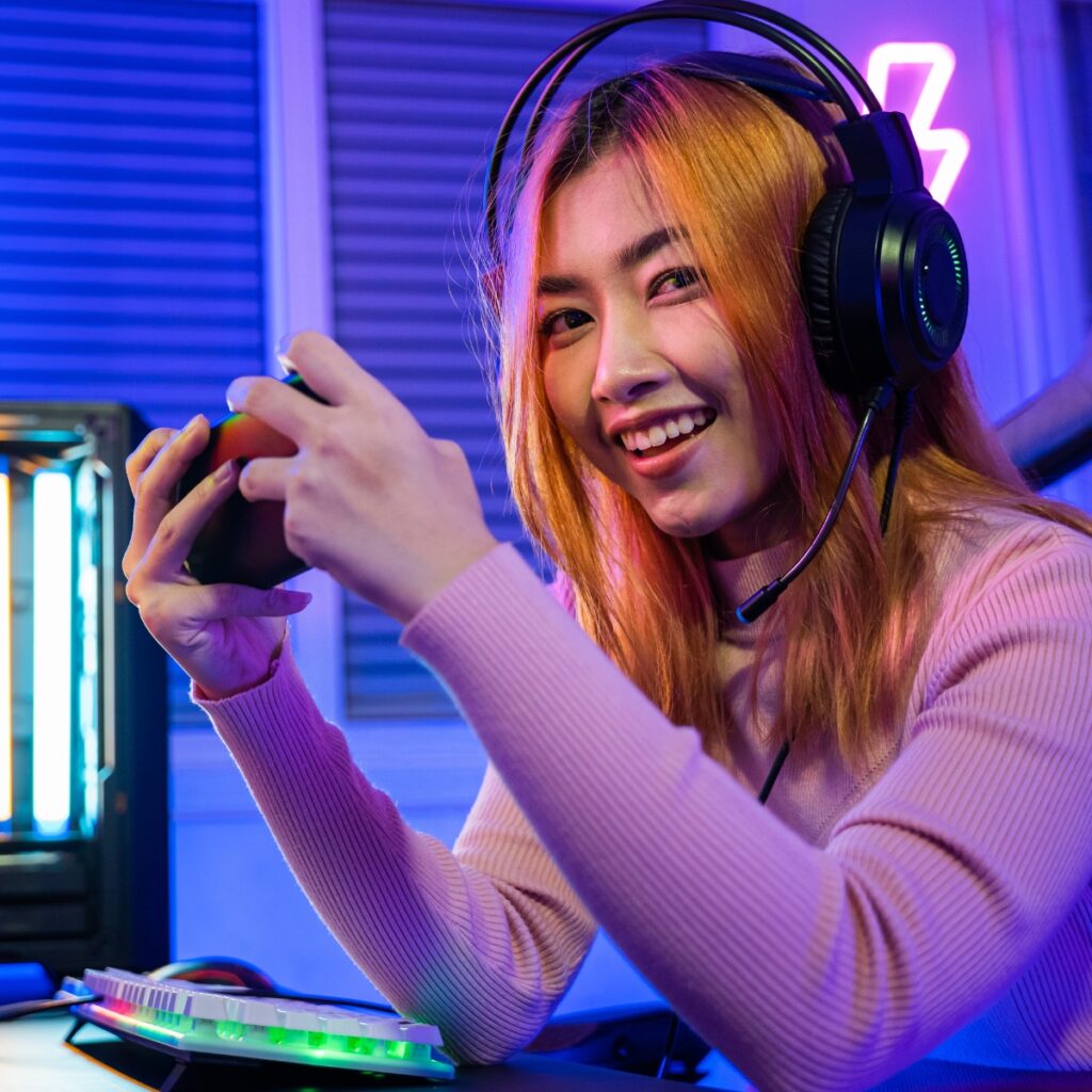 Woman playing video games with headphones.