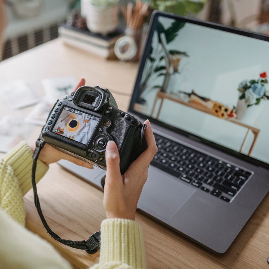 Woman showing how influencers make money with a licensed photo on a camera.